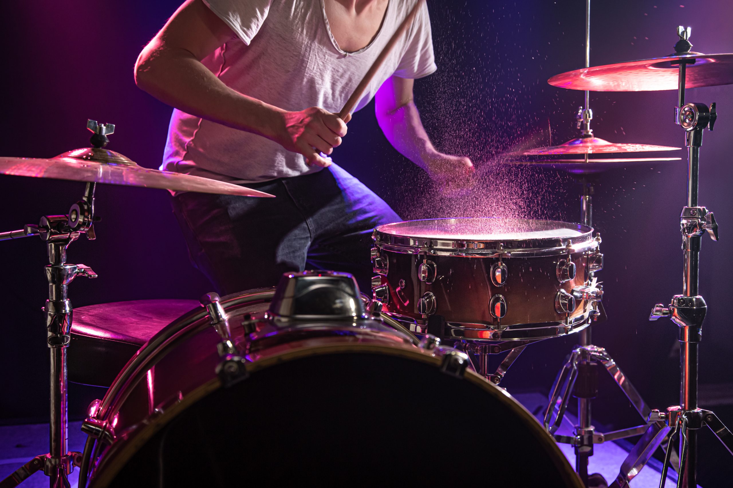 the drummer plays the drums scaled